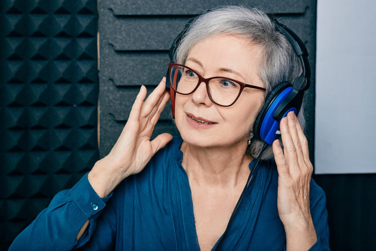 Older woman taking a hearing test.