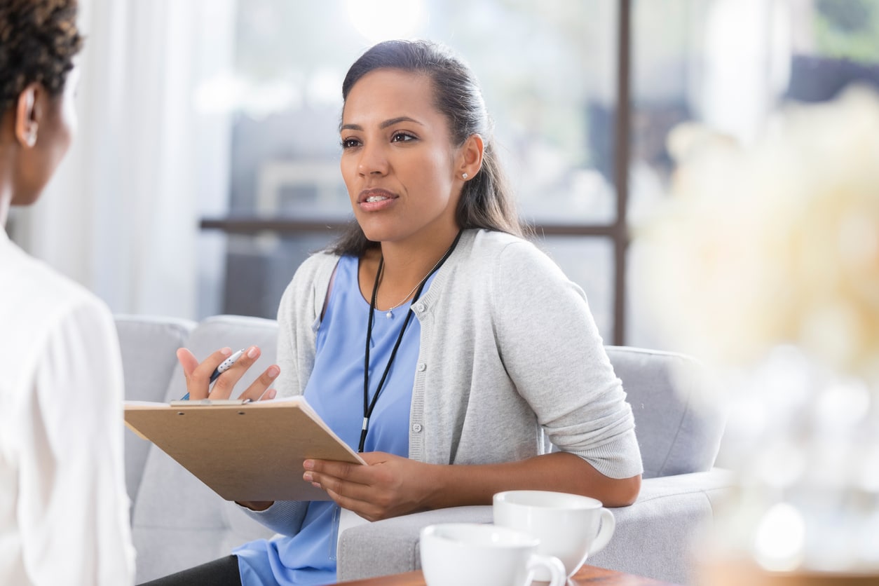 Patient discussing medication with her doctor.