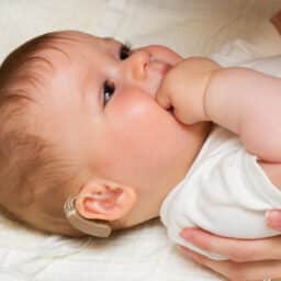 Infant with a hearing aid